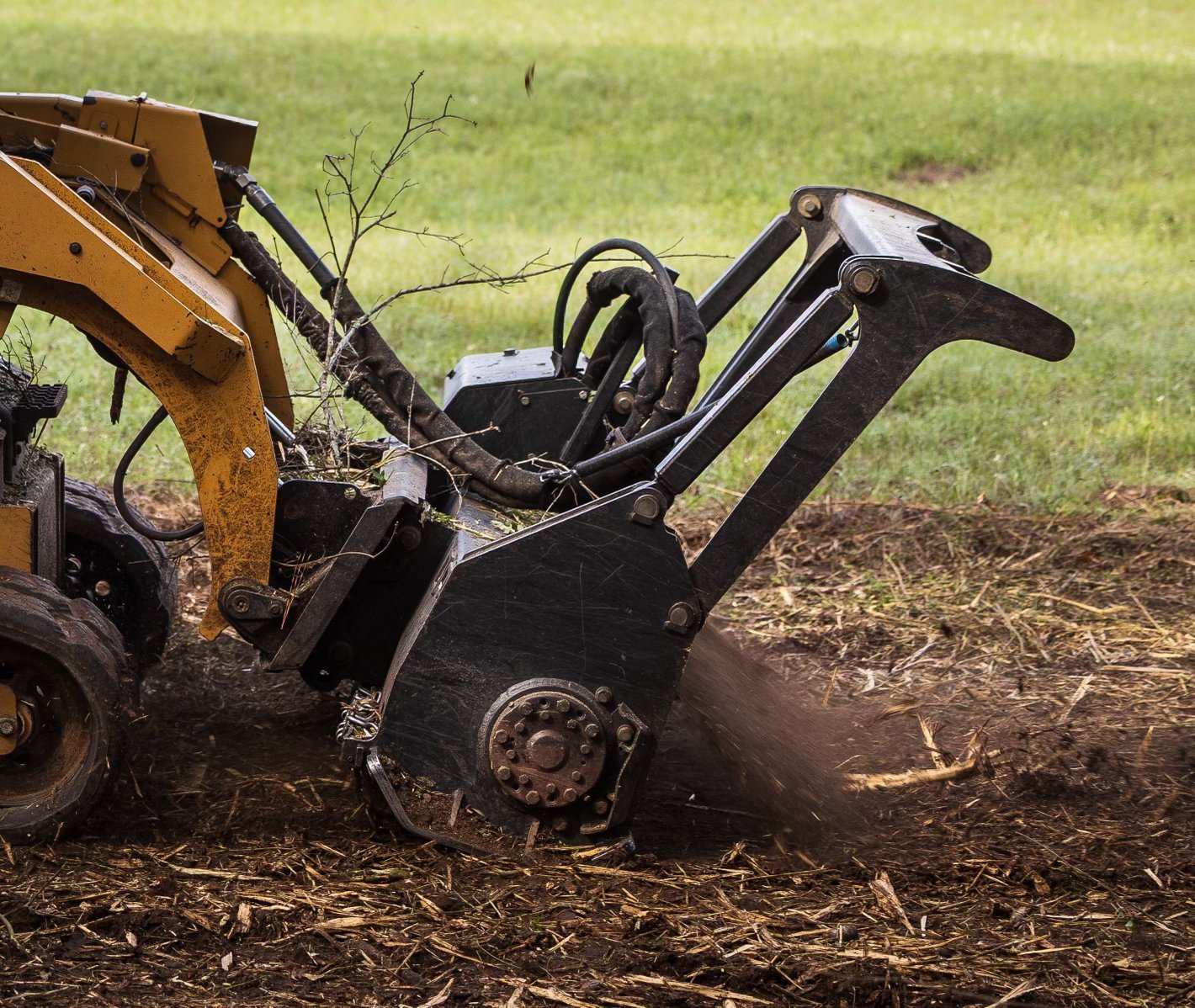 Forestry mulching head clearing brush for a shooting lane